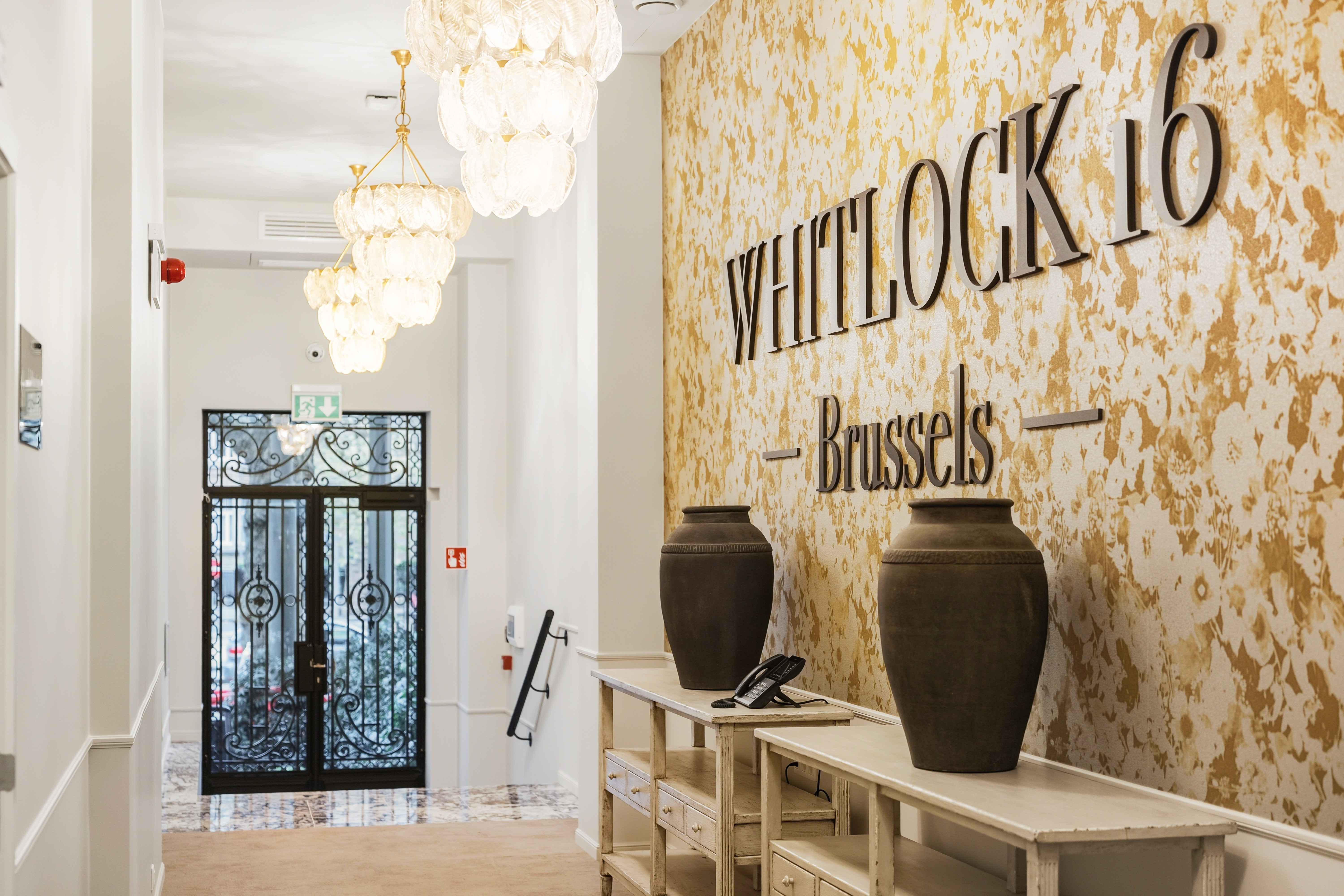 Entrance hall of Whitlock16 aparthotel in Brussels with elegant interior design